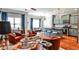 Open-concept living area with colorful decor and modern kitchen featuring a breakfast bar and updated appliances at 2250 W Village Junction Se Way, Smyrna, GA 30080