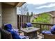 Outdoor patio featuring comfortable seating with blue cushions and a stone firepit table at 2250 W Village Junction Se Way, Smyrna, GA 30080