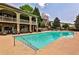 Beautiful community pool with ample seating, barbecue, and well-maintained landscaping in a serene setting at 2250 W Village Junction Se Way, Smyrna, GA 30080