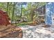 Concrete driveway near landscaped backyard and the wooden deck/stairs to porch at 3015 Larkspur Ct, Cumming, GA 30041