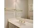 Bathroom with marble countertop, gold hardware and decorative cabinets at 3015 Larkspur Ct, Cumming, GA 30041