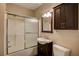 Bathroom with tub shower, vanity, mirror, cabinet and commode at 3015 Larkspur Ct, Cumming, GA 30041
