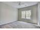 Bedroom with carpet, neutral walls and a large window with outdoor views at 3015 Larkspur Ct, Cumming, GA 30041