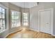 Corner bedroom with plenty of natural light, neutral paint, and hardwood floors at 3015 Larkspur Ct, Cumming, GA 30041