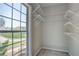 Walk-in closet with window and wire shelving overlooking the yard at 3015 Larkspur Ct, Cumming, GA 30041