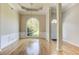 Dining area with hardwood floors and large arched window at 3015 Larkspur Ct, Cumming, GA 30041