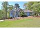 Attractive exterior with mature trees and landscaped front yard at 3015 Larkspur Ct, Cumming, GA 30041
