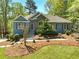 Charming home with stone accents and a beautifully landscaped front yard at 3015 Larkspur Ct, Cumming, GA 30041