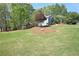 Charming blue home with a well-manicured lawn and mature trees at 3015 Larkspur Ct, Cumming, GA 30041