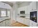 Updated kitchen space featuring stainless appliances, white cabinetry and plenty of lighting at 3015 Larkspur Ct, Cumming, GA 30041