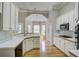 Bright kitchen with white cabinets, wood countertops, and stainless steel appliances at 3015 Larkspur Ct, Cumming, GA 30041
