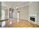 Sunlit living room featuring hardwood floors and cozy fireplace at 3015 Larkspur Ct, Cumming, GA 30041