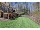 The backyard features a lush green lawn, a privacy fence, mature trees, and a patio area at 4765 Karls Gate Dr, Marietta, GA 30068