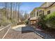 Expansive backyard featuring a covered patio, landscaped areas, and a wooded backdrop at 4765 Karls Gate Dr, Marietta, GA 30068
