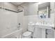 Bathroom with a shower/tub combo, wainscoting and black-and-white tile floor at 4765 Karls Gate Dr, Marietta, GA 30068