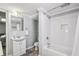 Bathroom featuring a single sink vanity, toilet, and a tiled shower with a glass door at 4765 Karls Gate Dr, Marietta, GA 30068