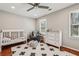 Bedroom with gray walls, wood floors, a ceiling fan, and lots of natural light at 4765 Karls Gate Dr, Marietta, GA 30068