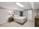 Cozy bedroom featuring a queen-sized bed, nightstand, and soft neutral color palette at 4765 Karls Gate Dr, Marietta, GA 30068