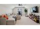 Bonus room with a sectional sofa, an office area, and a ceiling fan at 4765 Karls Gate Dr, Marietta, GA 30068