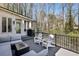 Spacious deck with outdoor seating, perfect for entertaining or grilling outdoors with a view of the wooded backyard at 4765 Karls Gate Dr, Marietta, GA 30068
