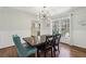 Bright dining room featuring hardwood floors and a contemporary light fixture and views of the kitchen at 4765 Karls Gate Dr, Marietta, GA 30068