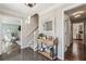 Inviting foyer with polished floors, decorative console table, and staircase leading to the upper level at 4765 Karls Gate Dr, Marietta, GA 30068