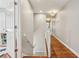 Upstairs hallway with hardwood floors on one side and carpeted stairs on the other at 4765 Karls Gate Dr, Marietta, GA 30068