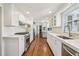 The modern kitchen features stainless steel appliances, white cabinets, and quartz countertops at 4765 Karls Gate Dr, Marietta, GA 30068