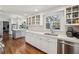 The modern kitchen features stainless steel appliances, white cabinets, and quartz countertops at 4765 Karls Gate Dr, Marietta, GA 30068