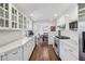 The modern kitchen features stainless steel appliances, white cabinets, and quartz countertops at 4765 Karls Gate Dr, Marietta, GA 30068