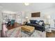 Cozy living room with stylish decor, hardwood floors, and a view into the dining area at 4765 Karls Gate Dr, Marietta, GA 30068