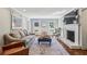 Bright living room boasts large windows, a cozy fireplace, and stylish furnishings at 4765 Karls Gate Dr, Marietta, GA 30068