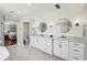 Bright main bathroom with double sinks, white cabinets, and modern finishes at 4765 Karls Gate Dr, Marietta, GA 30068