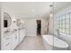 Luxurious main bathroom with double vanity, freestanding tub, and access to closet at 4765 Karls Gate Dr, Marietta, GA 30068