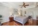 Lovely main bedroom features tray ceiling, hardwood flooring, and ensuite bathroom at 4765 Karls Gate Dr, Marietta, GA 30068