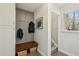 Mudroom features built-in storage, bench with baskets, and convenient access to the stairs at 4765 Karls Gate Dr, Marietta, GA 30068