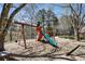 Community playground with a slide, swings, and climbing structure for Gathering fun near the lake at 4765 Karls Gate Dr, Marietta, GA 30068