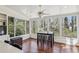 Sunroom featuring wood-paneled ceiling and large windows, offering backyard views at 4765 Karls Gate Dr, Marietta, GA 30068