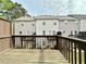View of the fenced-in backyard from wooden deck at 5401 Fox Creek Lane, Norcross, GA 30071