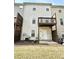 Features a private balcony, back door entry, patio, and a view of the lawn, perfect for outdoor relaxation at 5401 Fox Creek Lane, Norcross, GA 30071