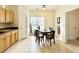 Cozy dining area features a charming round table, window with blinds, and a view to the backyard at 5401 Fox Creek Lane, Norcross, GA 30071