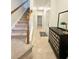 Inviting entryway featuring a staircase, neutral tones, and a stylish console table with decor at 5401 Fox Creek Lane, Norcross, GA 30071
