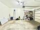 Spacious garage with ample room for parking and storage with work tables and shelves at 5401 Fox Creek Lane, Norcross, GA 30071