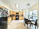 Eat-in kitchen features light wood cabinets, modern appliances, and plenty of counter space for cooking at 5401 Fox Creek Lane, Norcross, GA 30071