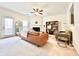 Bright living room with fireplace, neutral tones, ceiling fan, and lots of space for furniture at 5401 Fox Creek Lane, Norcross, GA 30071