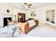 Spacious living room with fireplace, neutral tones, ceiling fan, and lots of space for furniture at 5401 Fox Creek Lane, Norcross, GA 30071