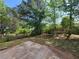 Private backyard features a patio area and lush greenery, perfect for relaxing or entertaining guests at 5820 Wellborn Oaks Ct, Lithonia, GA 30058