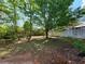 Large backyard offers privacy and space for gardening and outdoor activities at 5820 Wellborn Oaks Ct, Lithonia, GA 30058