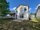 Large backyard boasts a concrete patio and ample green space for outdoor activities at 5820 Wellborn Oaks Ct, Lithonia, GA 30058