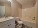 A bathroom features a vanity, toilet, and a tub-shower combo at 5820 Wellborn Oaks Ct, Lithonia, GA 30058